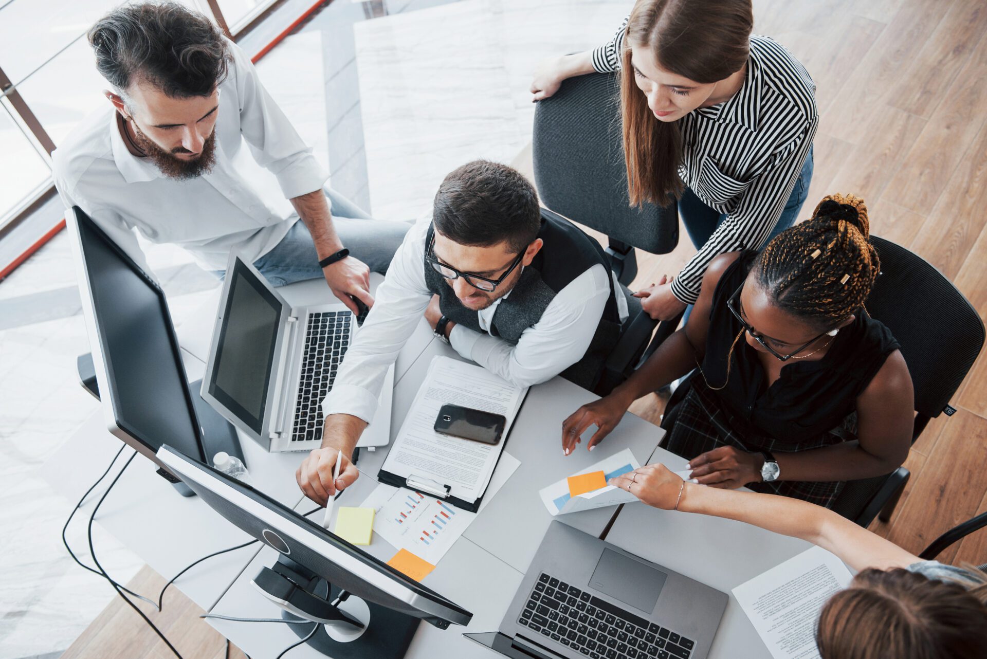 A group of multinational busy people working in the office.